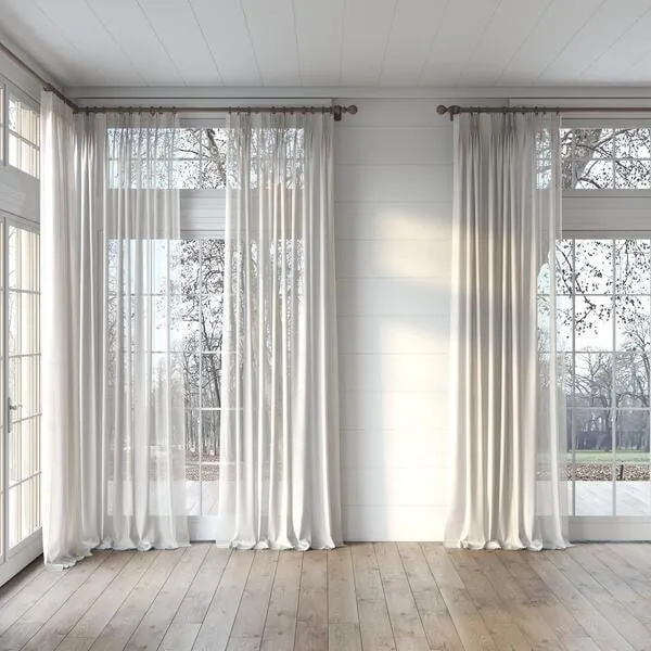 Alcova sheer curtains installed on floor-to-ceiling windows