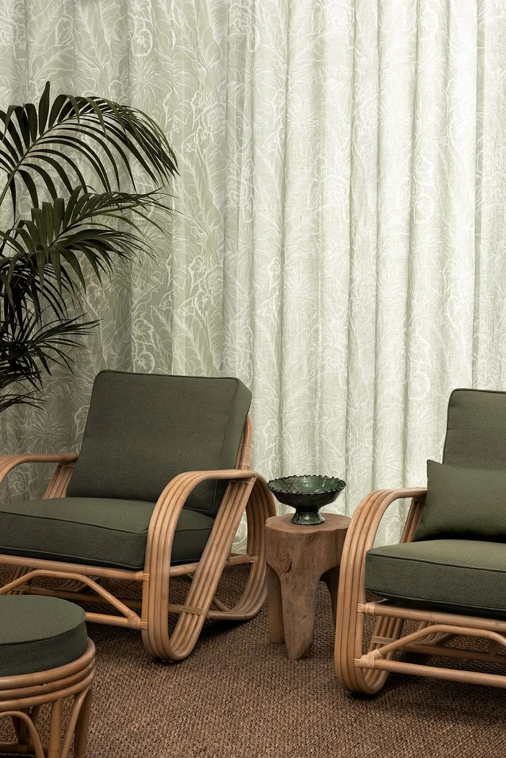 James Dunlop Palmery textured curtain fabric beside mid-century armchairs