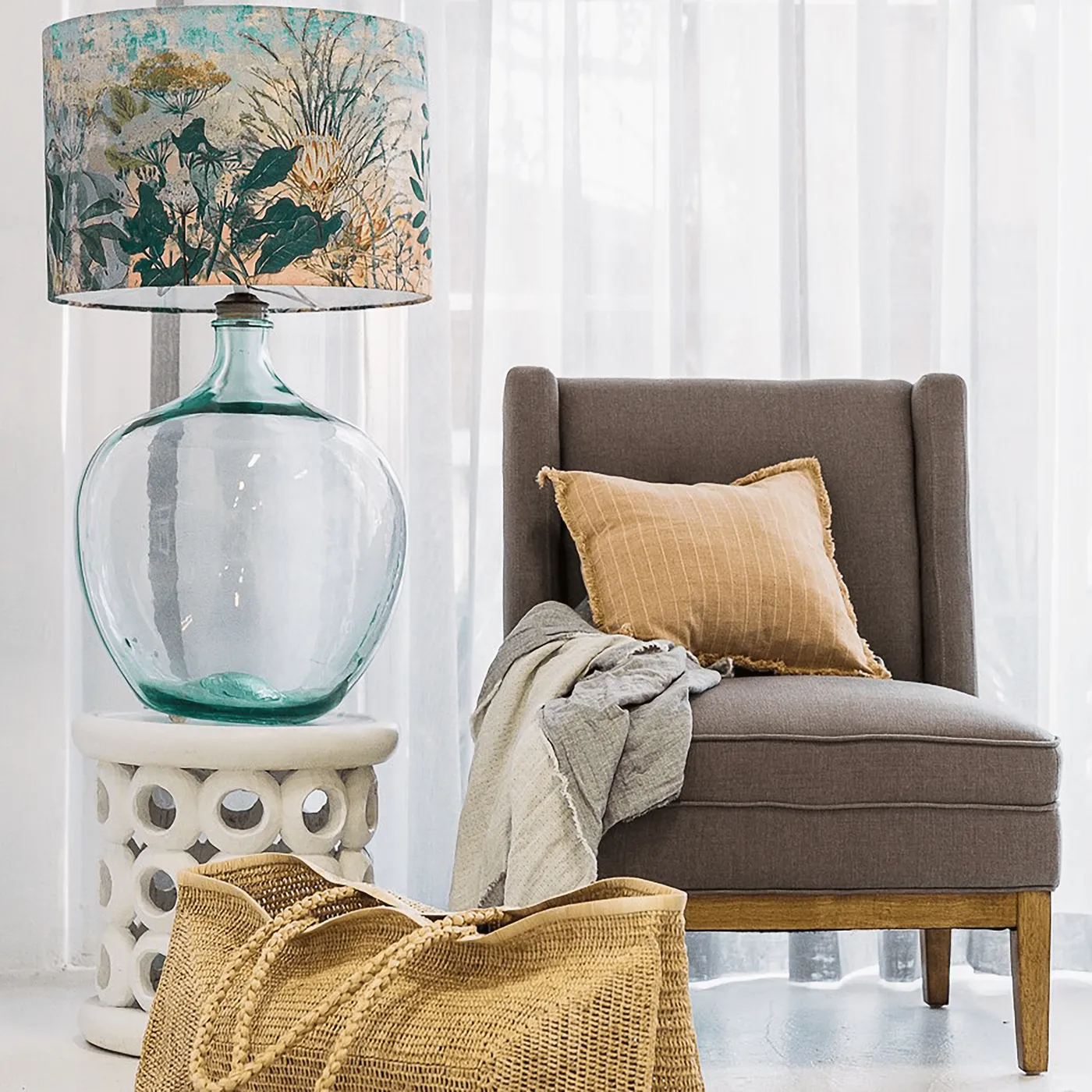 Zepel Bali roomset sheer curtains beside a velvet armchair