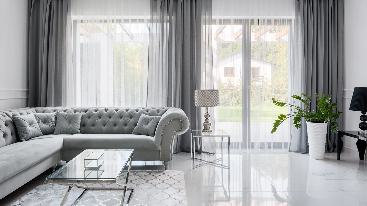 Finely textured sheer curtains in a formal living room